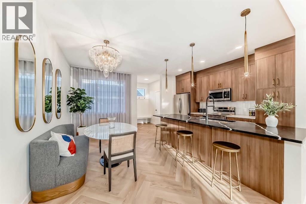 94 Agate Road, Cochrane, AB - Indoor Photo Showing Kitchen With Upgraded Kitchen