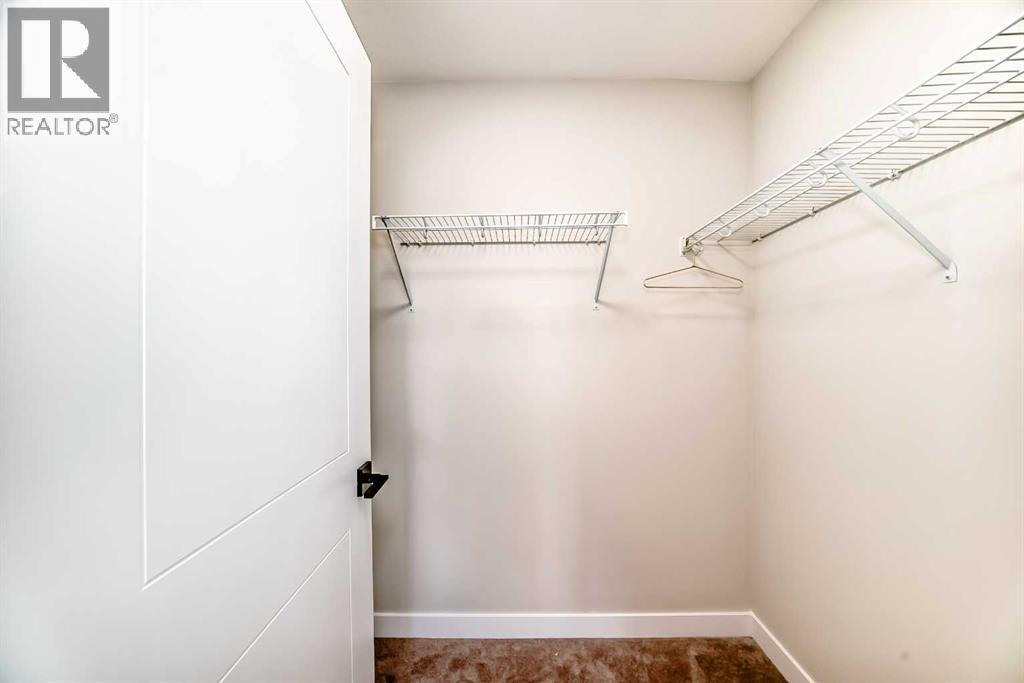 94 Agate Road, Cochrane, AB - Indoor With Storage