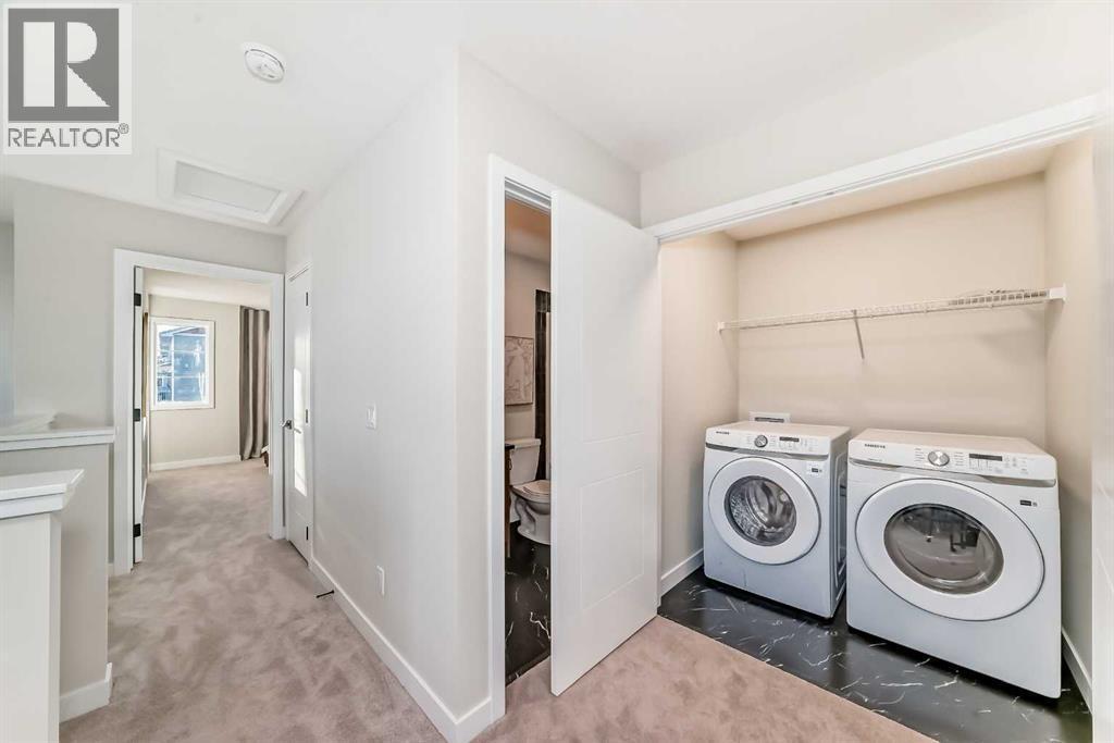 94 Agate Road, Cochrane, AB - Indoor Photo Showing Laundry Room