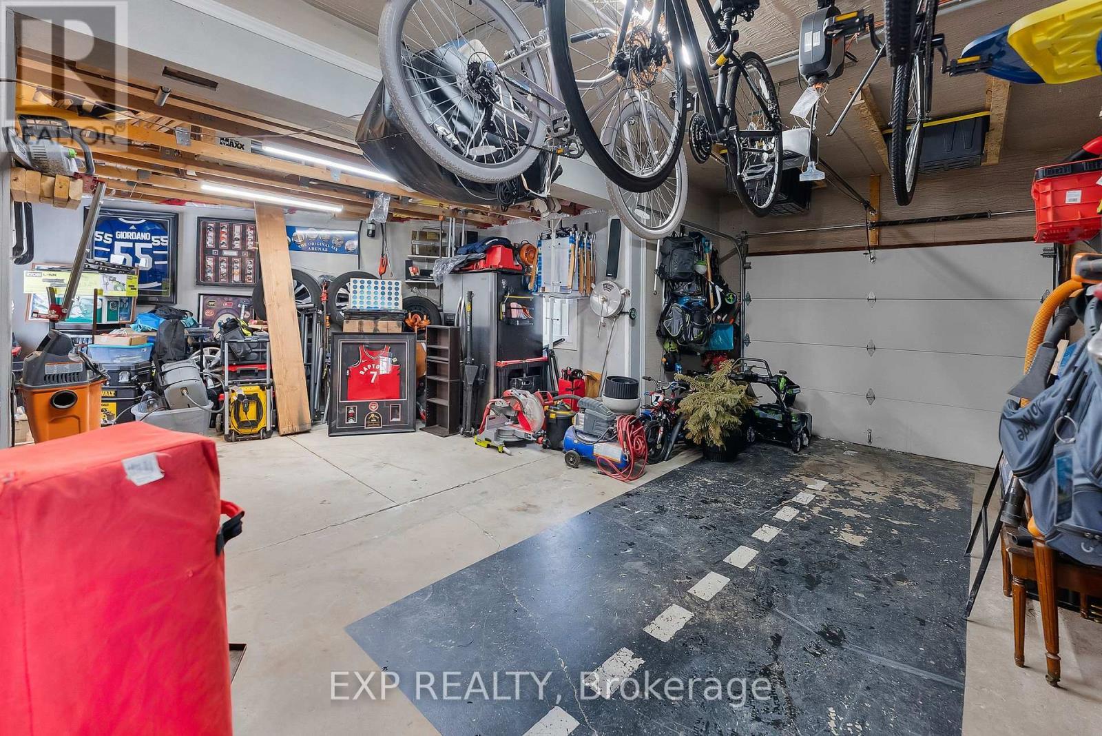 Single Garage-- with Alcove for Big Kid Toys! - 6970 Concord Crescent, Niagara Falls (Arad/Fallsview), ON - Indoor Photo Showing Garage
