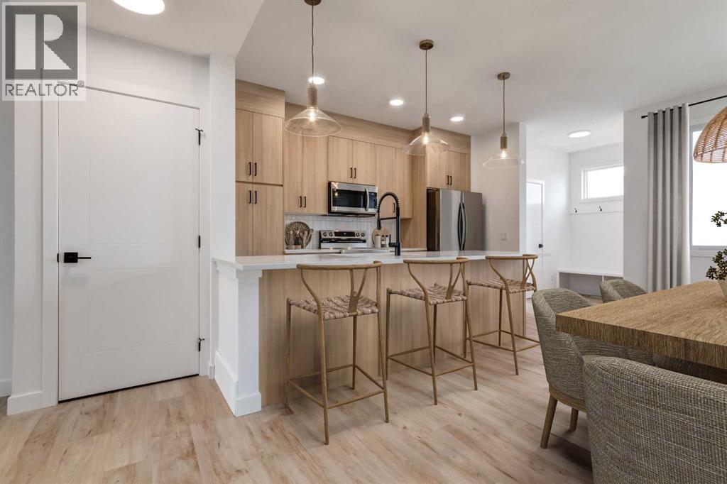 Virtually Staged - 98 Agate Road, Cochrane, AB - Indoor Photo Showing Kitchen With Upgraded Kitchen