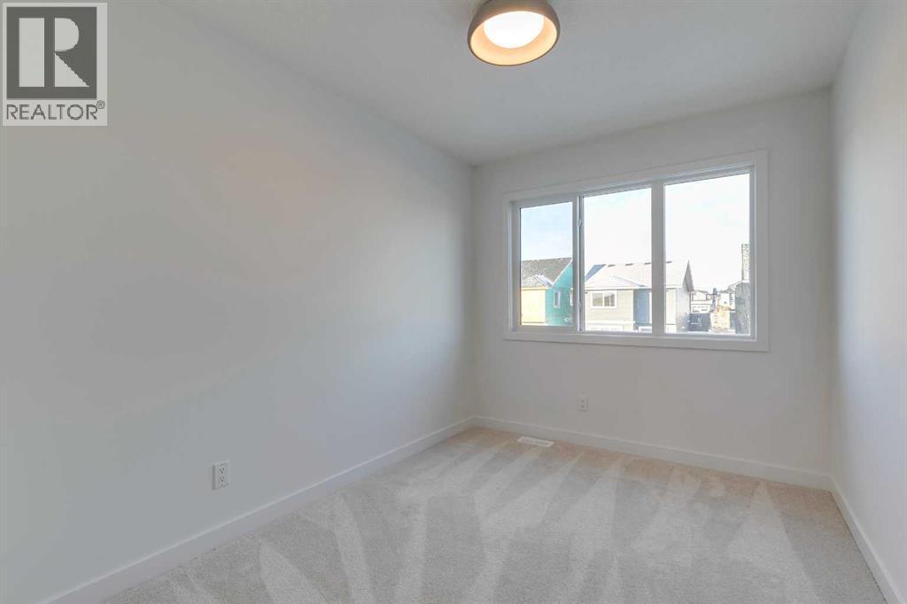 98 Agate Road, Cochrane, AB - Indoor Photo Showing Other Room