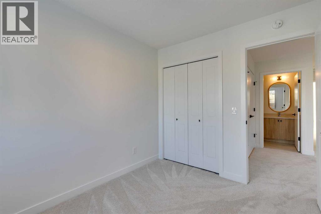 98 Agate Road, Cochrane, AB - Indoor Photo Showing Other Room