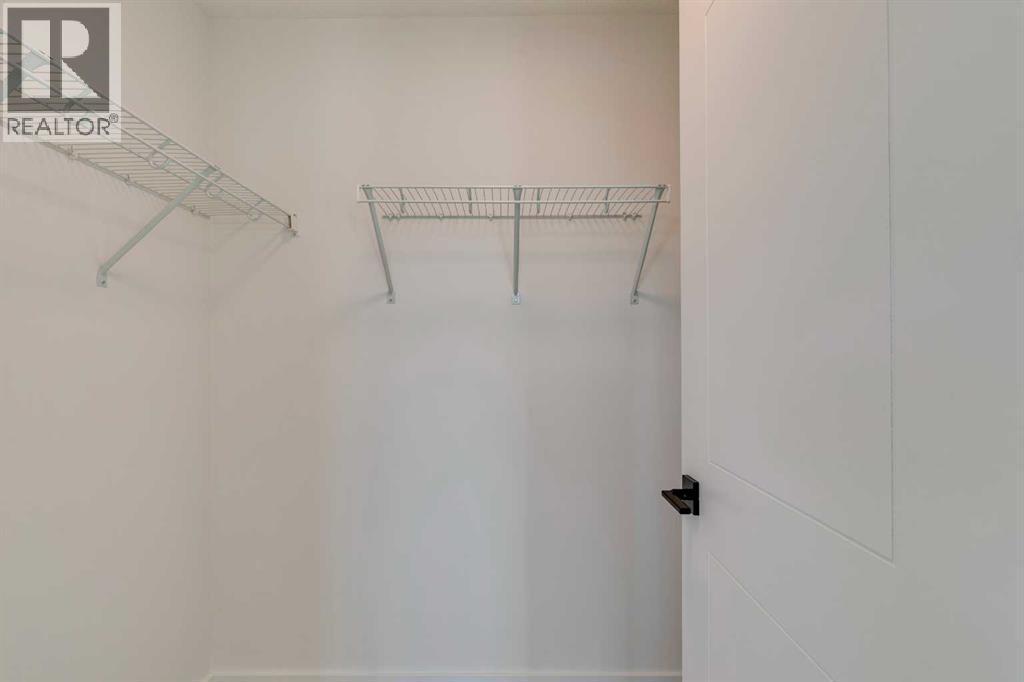 98 Agate Road, Cochrane, AB - Indoor With Storage