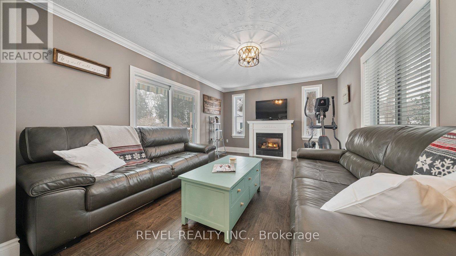 6 Decou Road, Norfolk, ON - Indoor Photo Showing Living Room With Fireplace