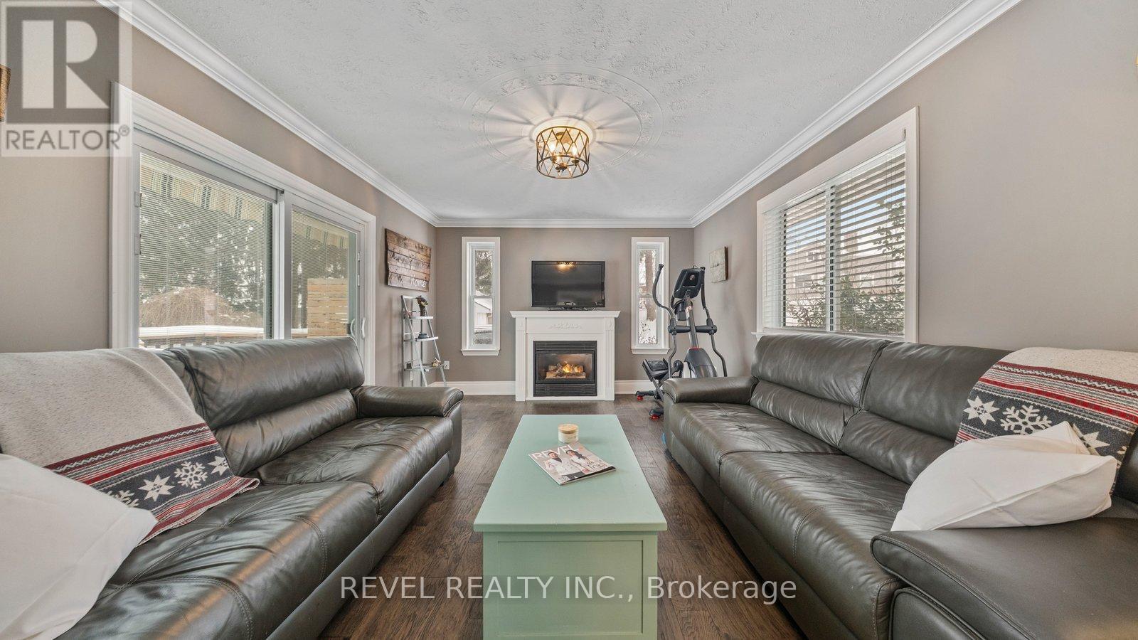 6 Decou Road, Norfolk, ON - Indoor Photo Showing Living Room With Fireplace