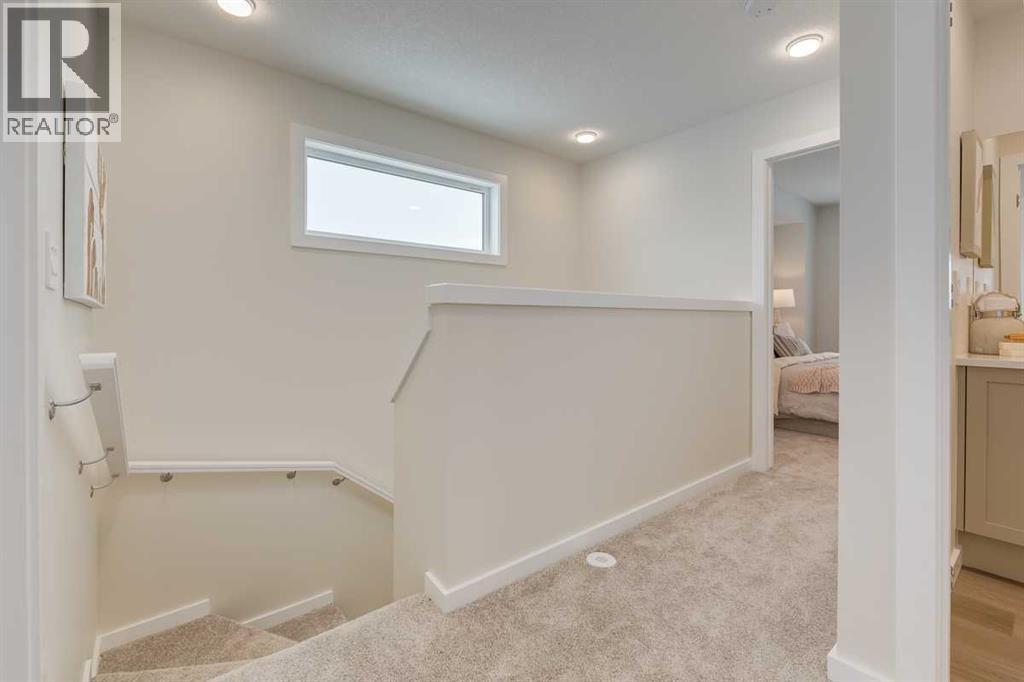 PLEASE NOTE: Photos are of a finished Showhome of the same model – fit and finish may differ on finished spec home. Interior selections and floorplans shown in photos - 62 Starling Boulevard Nw, Calgary, AB - Indoor Photo Showing Other Room