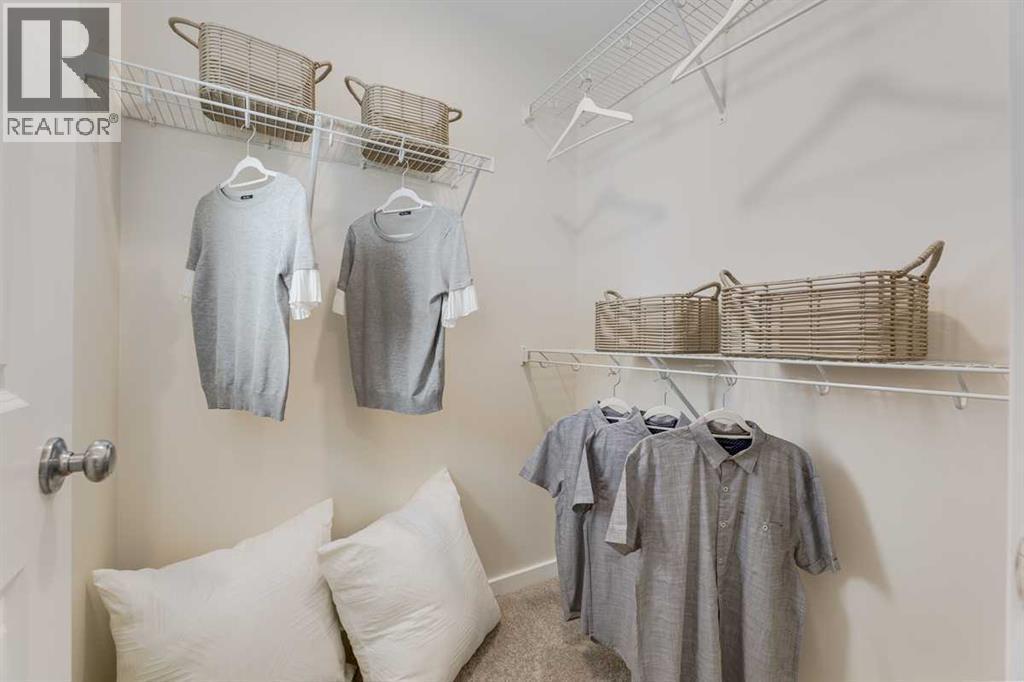 PLEASE NOTE: Photos are of a finished Showhome of the same model – fit and finish may differ on finished spec home. Interior selections and floorplans shown in photos - 62 Starling Boulevard Nw, Calgary, AB - Indoor With Storage