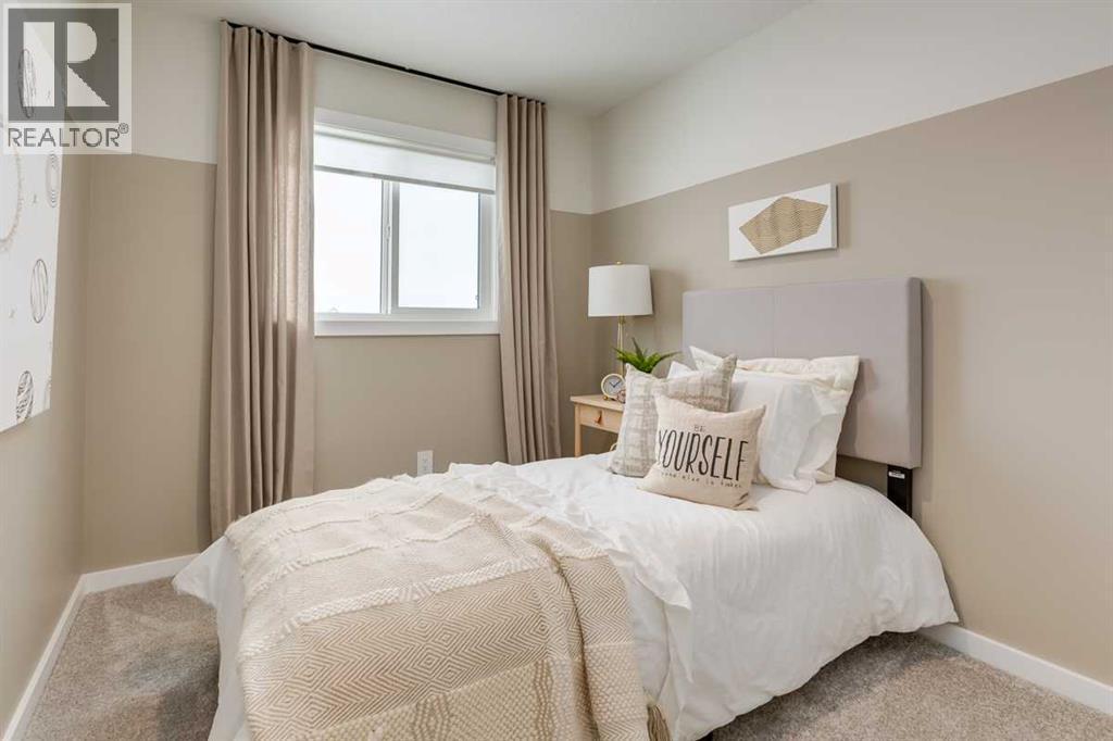 PLEASE NOTE: Photos are of a finished Showhome of the same model – fit and finish may differ on finished spec home. Interior selections and floorplans shown in photos - 62 Starling Boulevard Nw, Calgary, AB - Indoor Photo Showing Bedroom