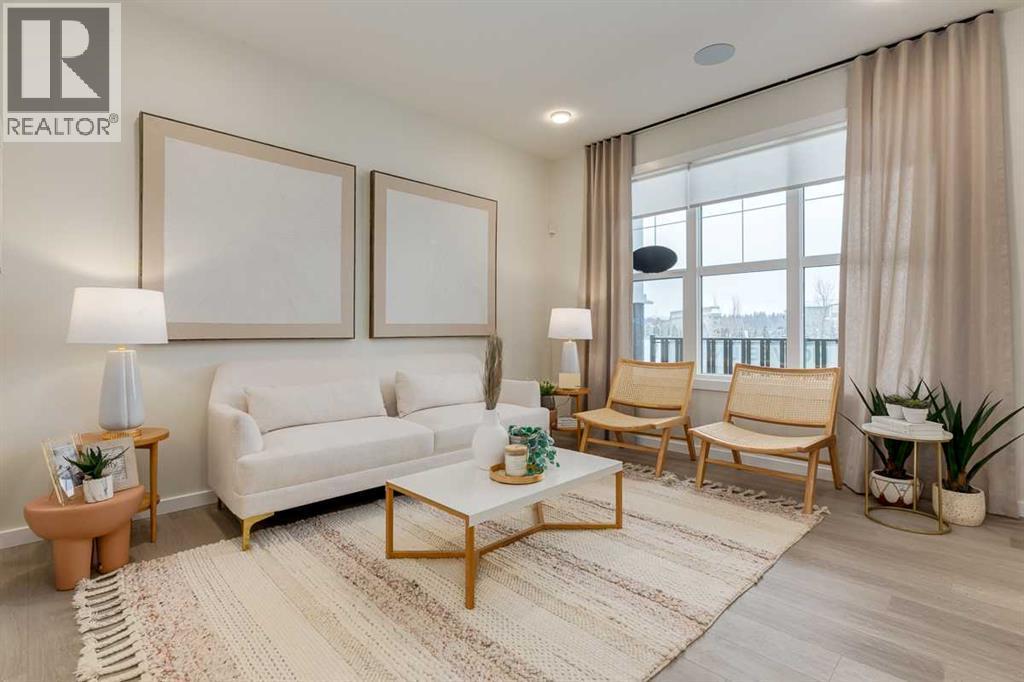 PLEASE NOTE: Photos are of a finished Showhome of the same model – fit and finish may differ on finished spec home. Interior selections and floorplans shown in photos - 62 Starling Boulevard Nw, Calgary, AB - Indoor Photo Showing Living Room