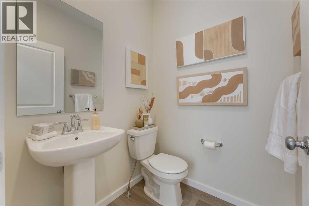 PLEASE NOTE: Photos are of a finished Showhome of the same model – fit and finish may differ on finished spec home. Interior selections and floorplans shown in photos - 62 Starling Boulevard Nw, Calgary, AB - Indoor Photo Showing Bathroom