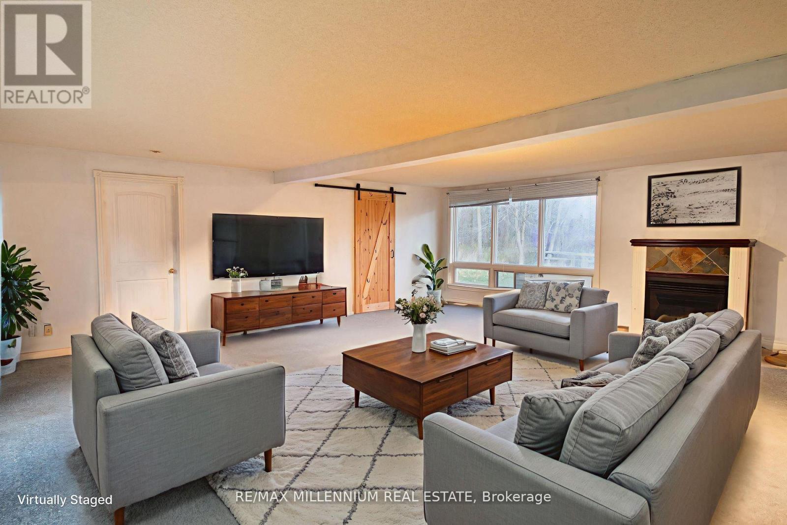 3021 Pinegrove Road, Springwater, ON - Indoor Photo Showing Living Room With Fireplace