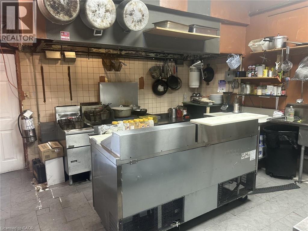 Kitchen with range hood - 597 King Street, Hamilton, ON