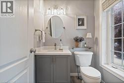 Bathroom featuring vanity and toilet -