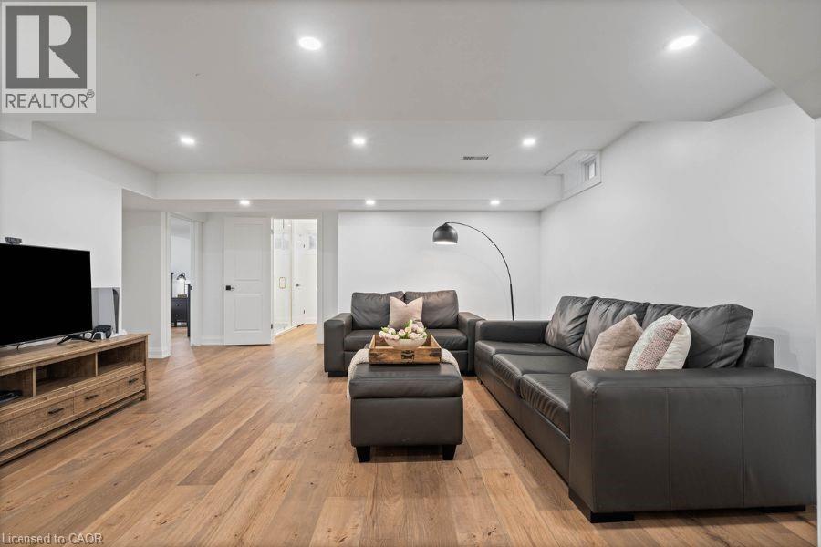 Living room featuring light wood-type flooring and recessed lighting - 151 Fair Street, Ancaster, ON