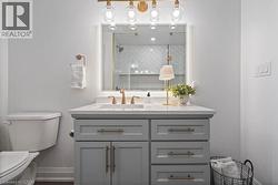 Full bath with vanity and tiled shower -