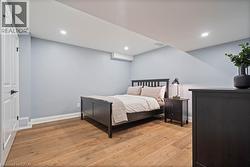 Bedroom featuring light wood finished floors and recessed lighting -