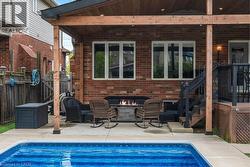 View of swimming pool featuring a patio and an outdoor living space -