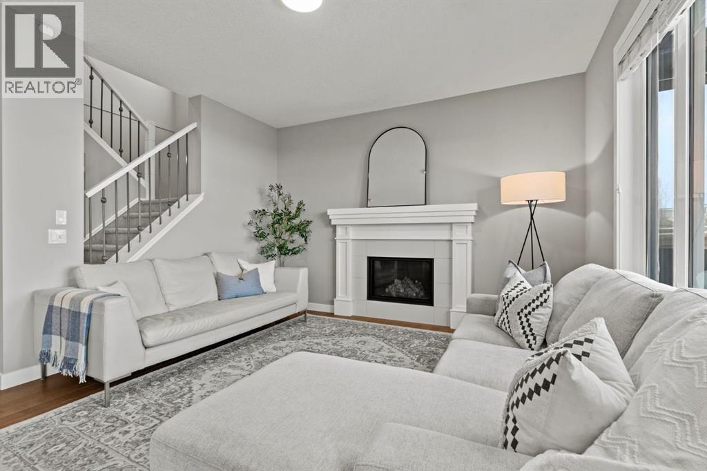 85 Mount Rae Heights, Okotoks, AB - Indoor Photo Showing Living Room With Fireplace