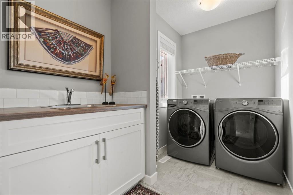 85 Mount Rae Heights, Okotoks, AB - Indoor Photo Showing Laundry Room