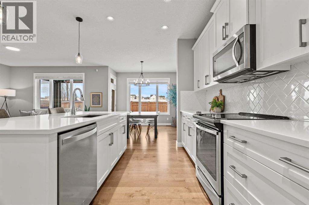85 Mount Rae Heights, Okotoks, AB - Indoor Photo Showing Kitchen With Stainless Steel Kitchen With Upgraded Kitchen