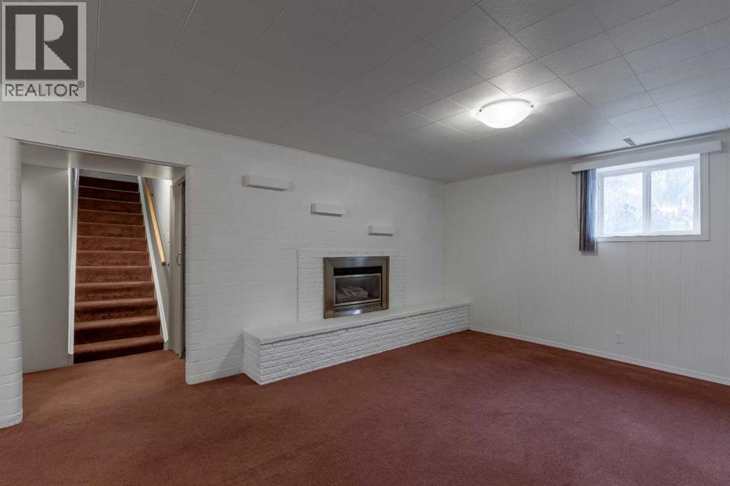 315 Dieppe Boulevard S, Lethbridge, AB - Indoor Photo Showing Other Room With Fireplace