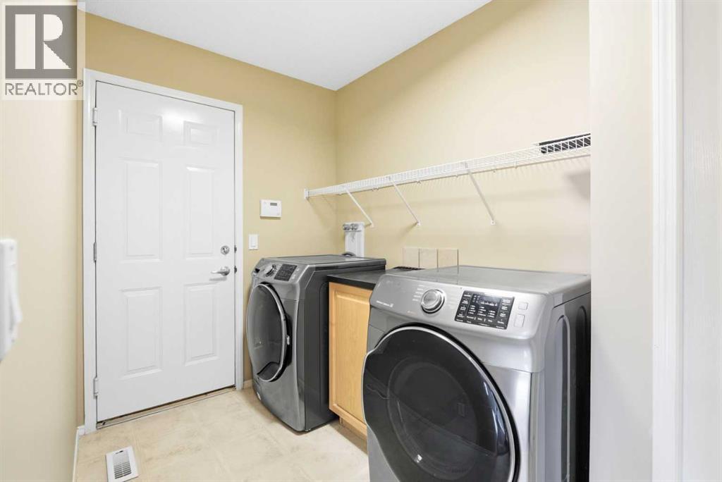 202 Panamount Court Nw, Calgary, AB - Indoor Photo Showing Laundry Room