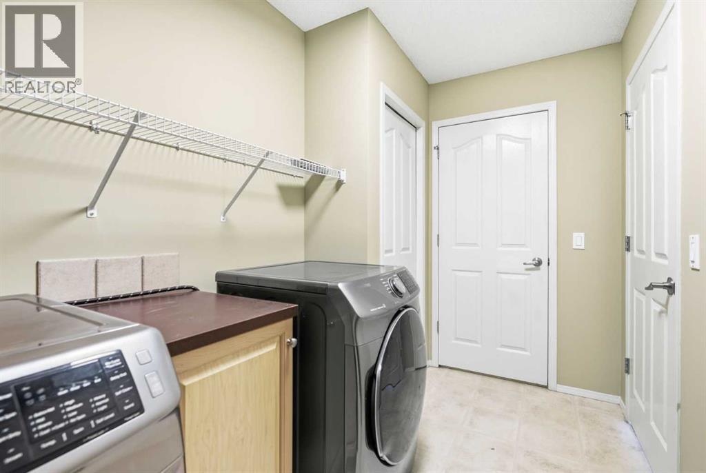 202 Panamount Court Nw, Calgary, AB - Indoor Photo Showing Laundry Room