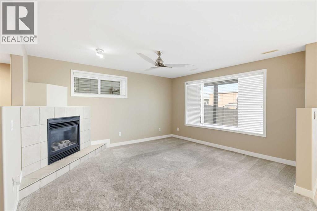 202 Panamount Court Nw, Calgary, AB - Indoor With Fireplace