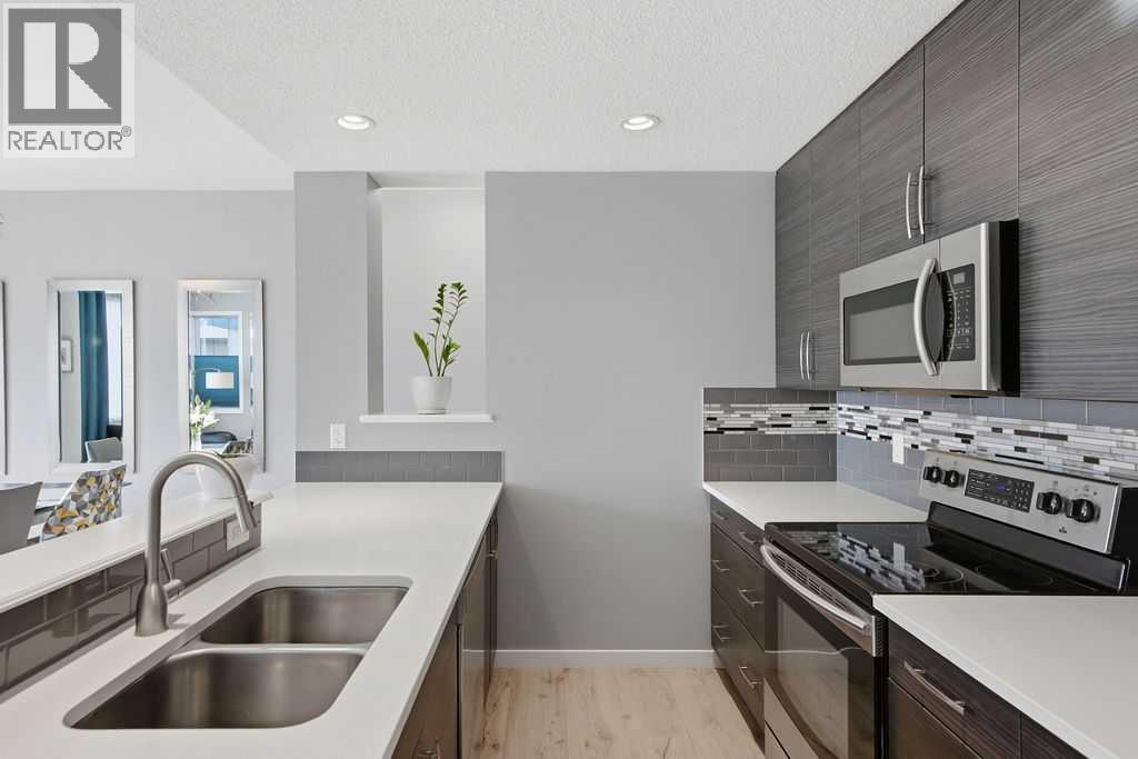 Quartz counters - 105 Chaparral Valley Crescent Se, Calgary, AB - Indoor Photo Showing Kitchen With Double Sink