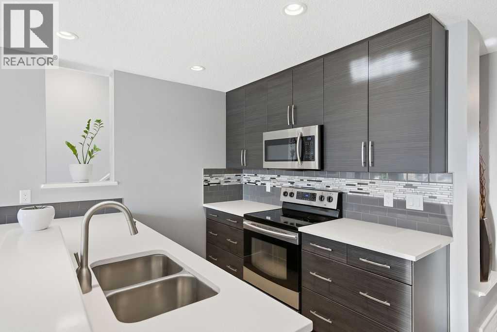 Double sink - 105 Chaparral Valley Crescent Se, Calgary, AB - Indoor Photo Showing Kitchen With Double Sink With Upgraded Kitchen