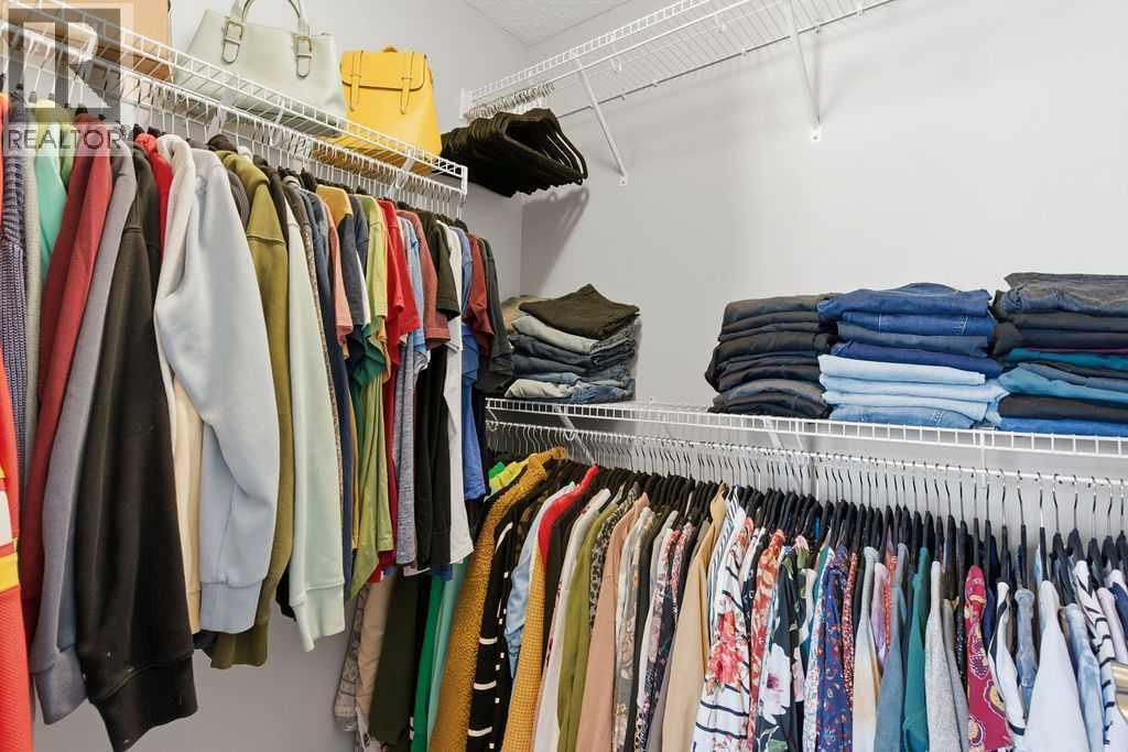 Walk in closet closet - 105 Chaparral Valley Crescent Se, Calgary, AB - Indoor With Storage
