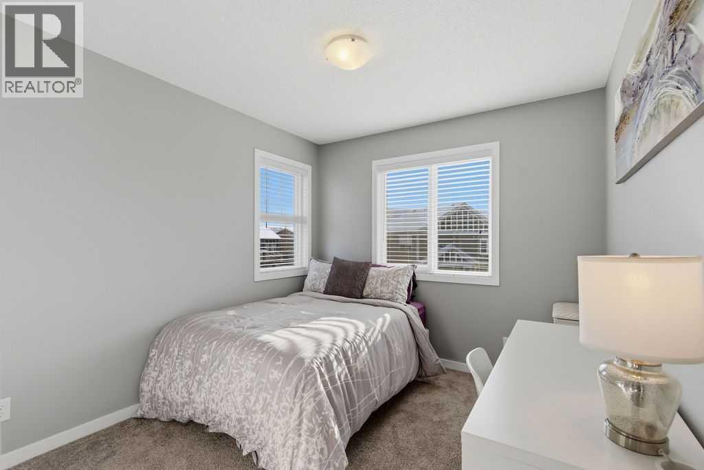 Bedroom #3 with corner windows - 105 Chaparral Valley Crescent Se, Calgary, AB - Indoor Photo Showing Bedroom