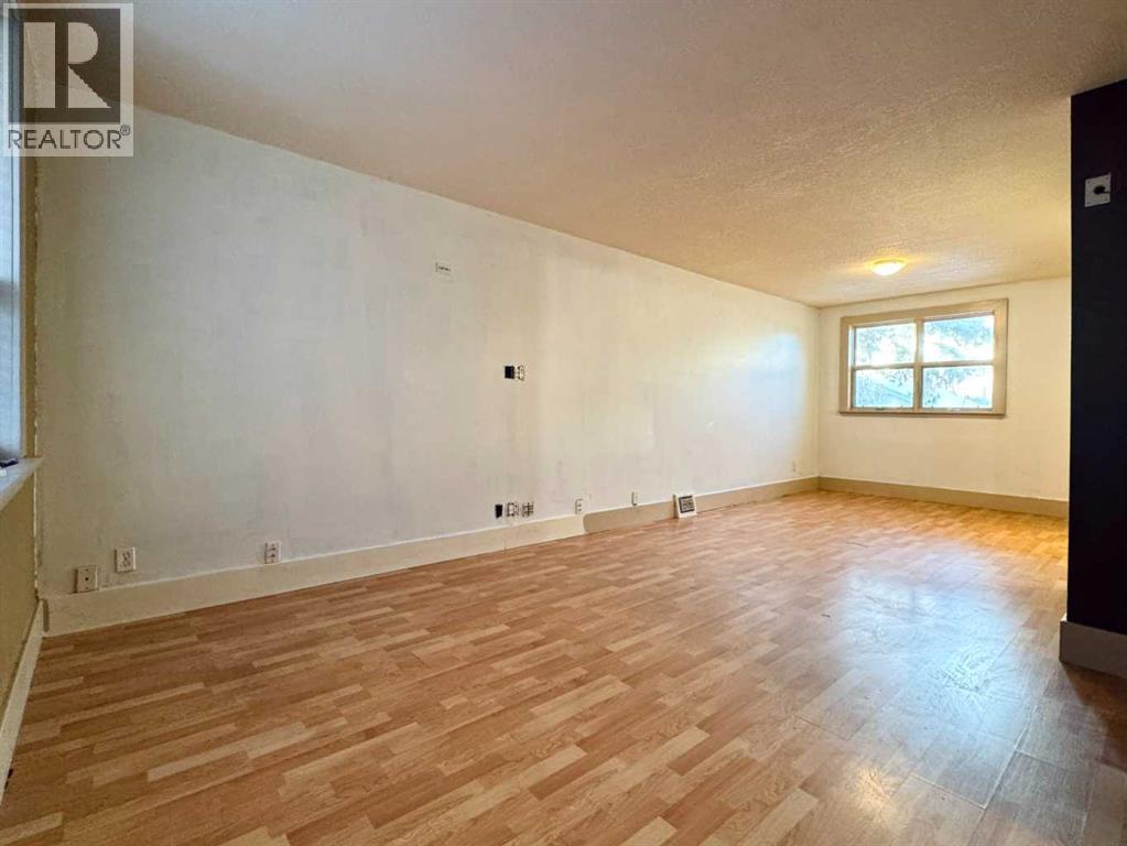 Living Room - 718 10 Street S, Lethbridge, AB - Indoor Photo Showing Other Room