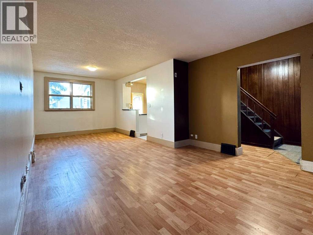Living Room - 718 10 Street S, Lethbridge, AB - Indoor Photo Showing Other Room