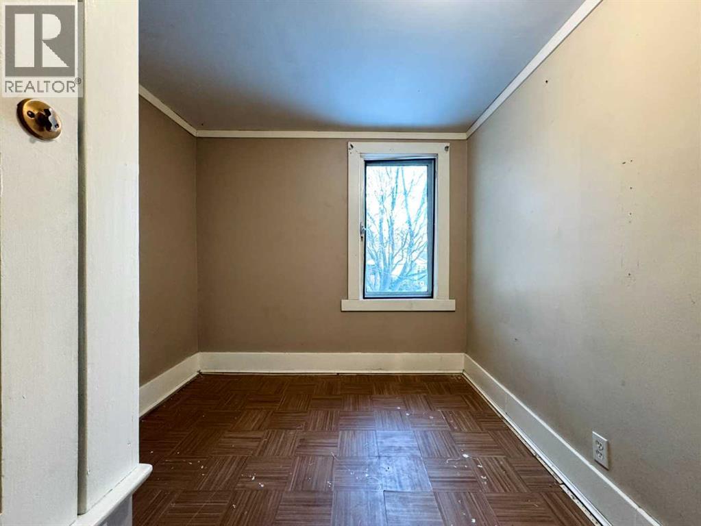 Bedroom 1 - 718 10 Street S, Lethbridge, AB - Indoor Photo Showing Other Room