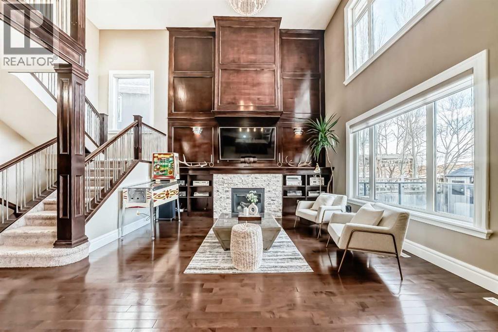 115 Wentworth Hill Sw, Calgary, AB - Indoor Photo Showing Living Room With Fireplace