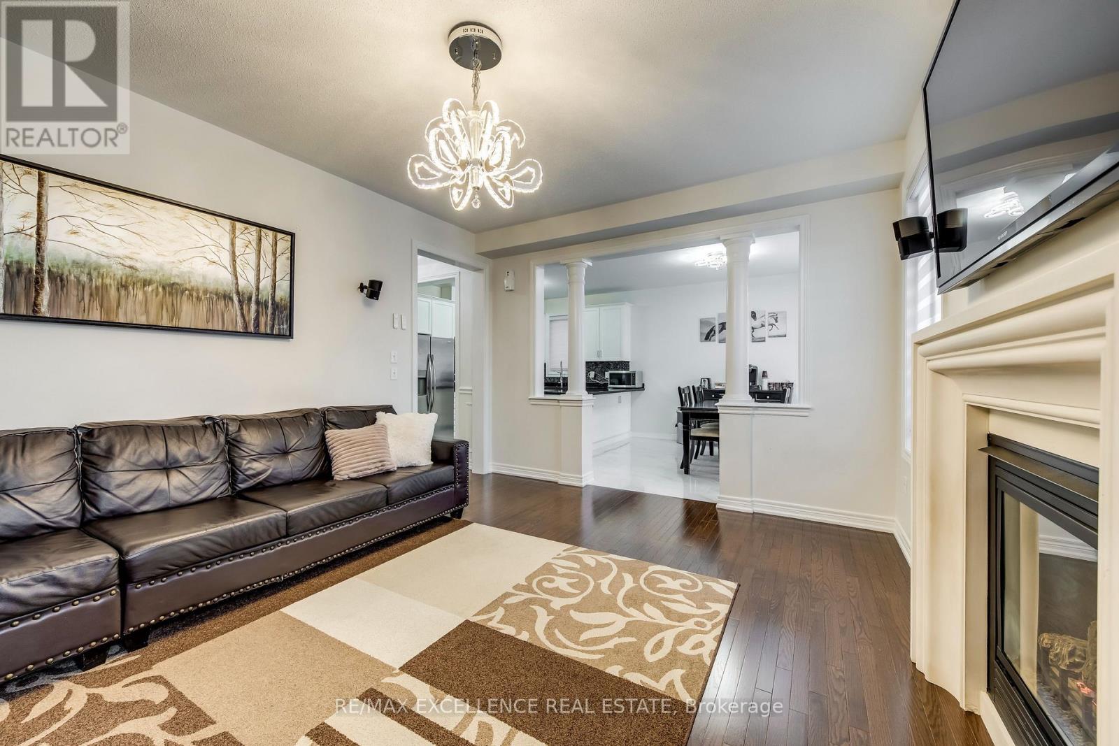 9 Natronia Trail, Brampton, ON - Indoor Photo Showing Living Room With Fireplace