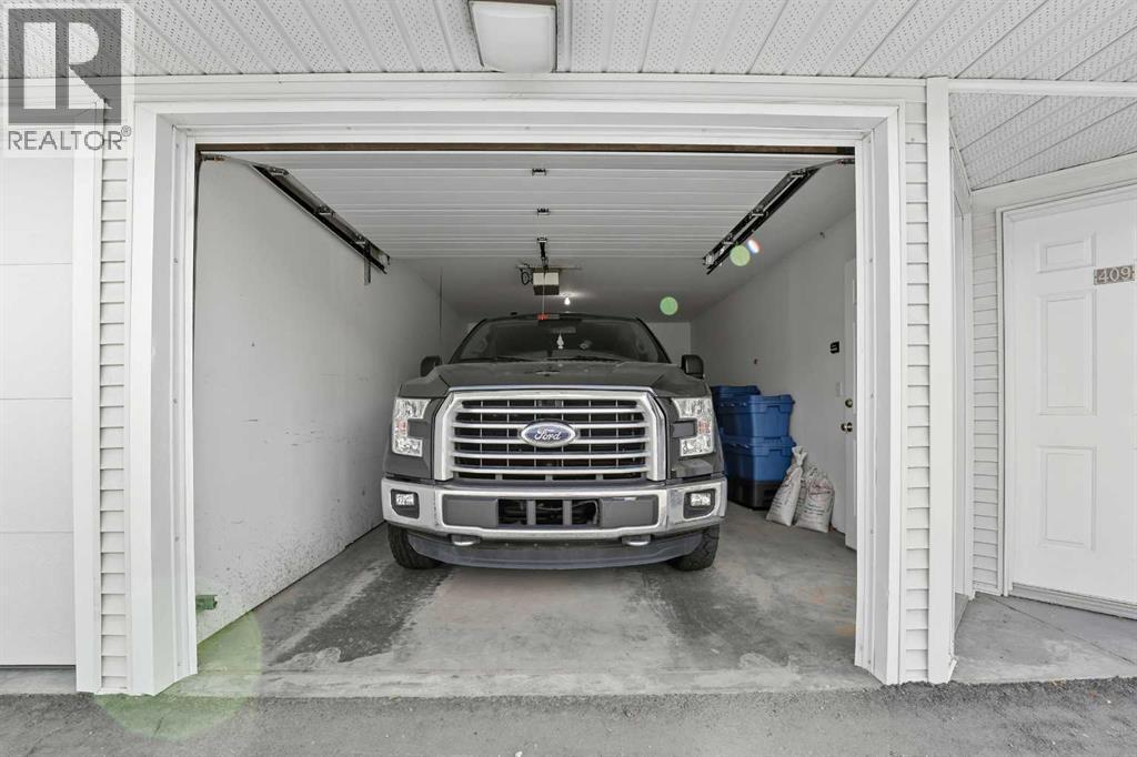 208, 6118 53 Avenue, Red Deer, AB - Indoor Photo Showing Garage