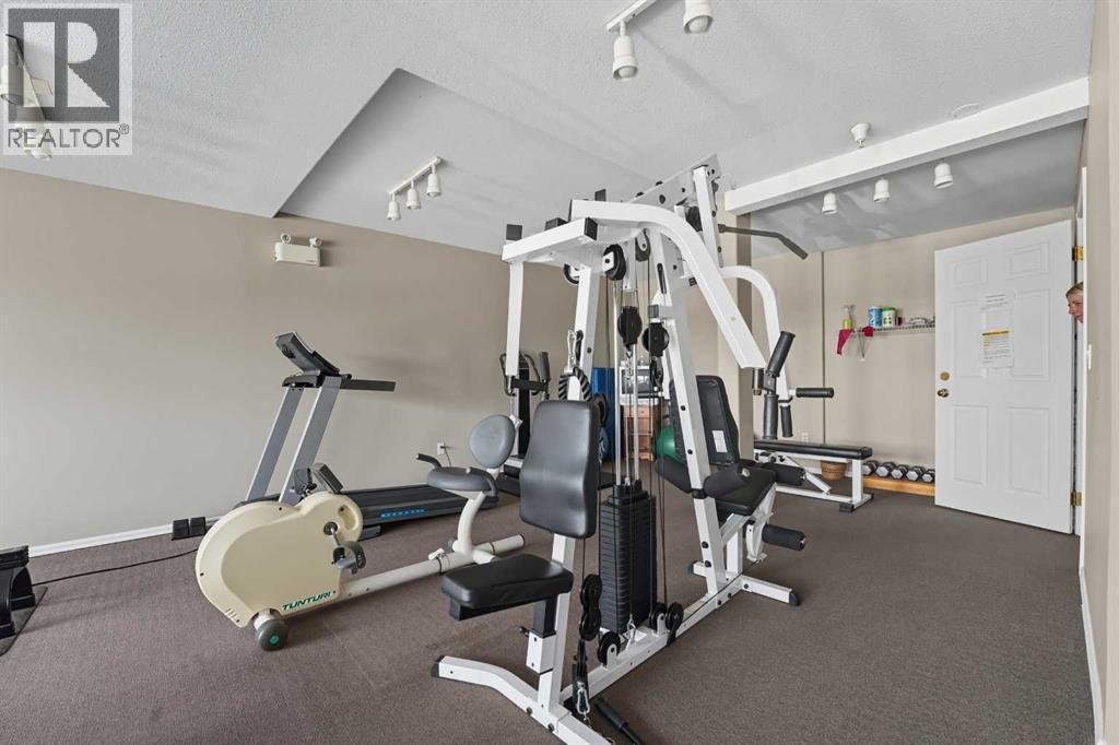 208, 6118 53 Avenue, Red Deer, AB - Indoor Photo Showing Gym Room