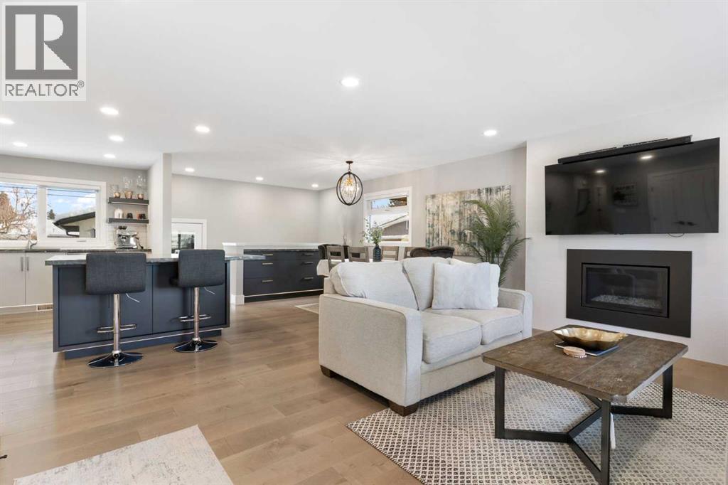 9936 Maplecreek Drive Se, Calgary, AB - Indoor Photo Showing Living Room With Fireplace