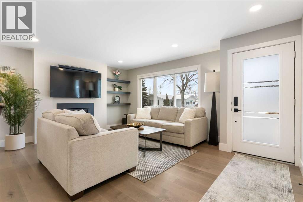9936 Maplecreek Drive Se, Calgary, AB - Indoor Photo Showing Living Room With Fireplace