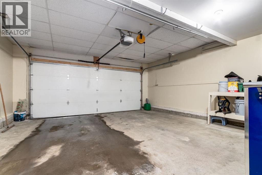 Double Car Garage - 327 Millview Place Sw, Calgary, AB - Indoor Photo Showing Garage