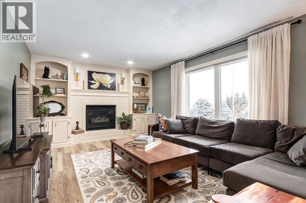 327 Millview Place Sw, Calgary, AB - Indoor Photo Showing Living Room With Fireplace