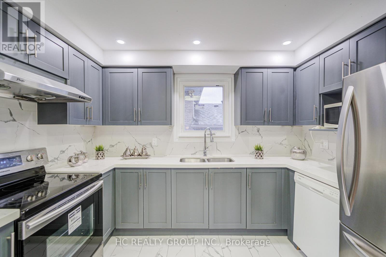 23 Boarhill Drive, Toronto, ON - Indoor Photo Showing Kitchen With Double Sink