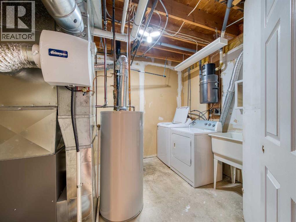 Basement Laundry Room - 626 Hawkstone Manor Nw, Calgary, AB - Indoor Photo Showing Laundry Room