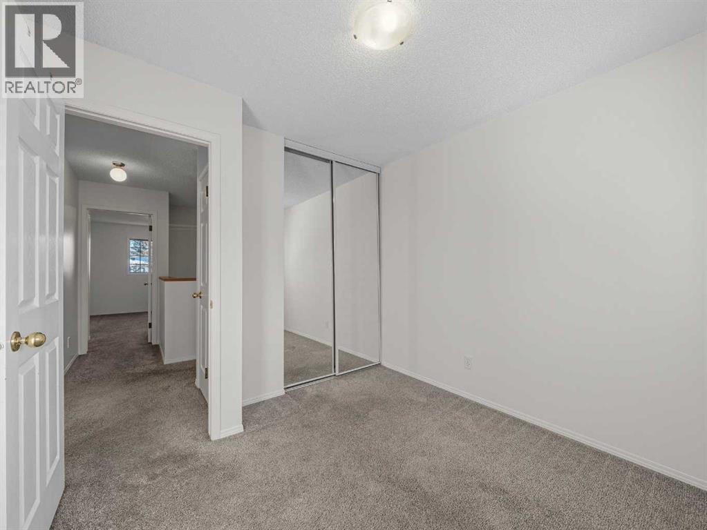 Upstairs Bedroom 2 - 626 Hawkstone Manor Nw, Calgary, AB - Indoor Photo Showing Other Room