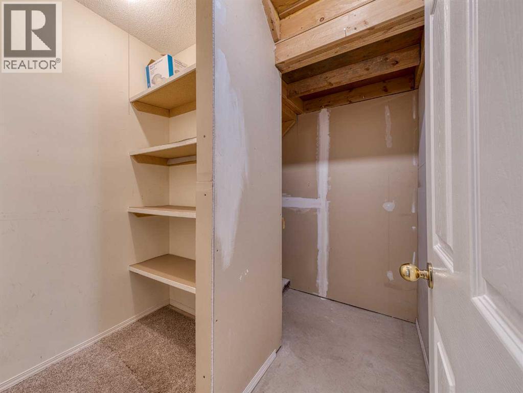Basement Storage Room - 626 Hawkstone Manor Nw, Calgary, AB - Indoor