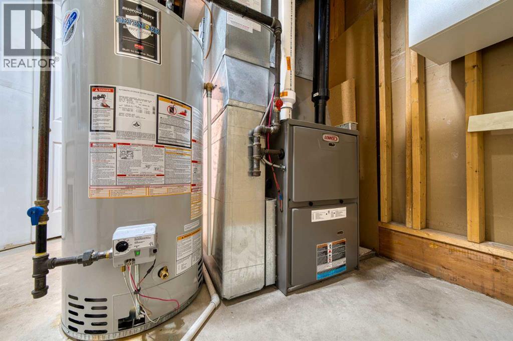 Furnace from 2017 Hot Water Tank from 2019 - 626 Hawkstone Manor Nw, Calgary, AB - Indoor Photo Showing Basement