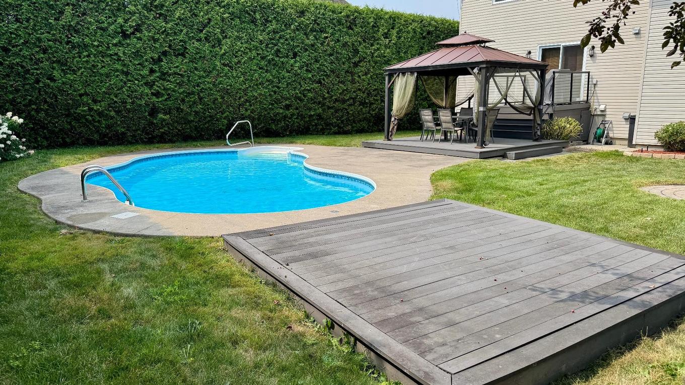 Backyard - 83 Rue Jean-Paul-Lemieux, Notre-Dame-De-L'Île-Perrot, QC - Outdoor With In Ground Pool With Deck Patio Veranda With Backyard